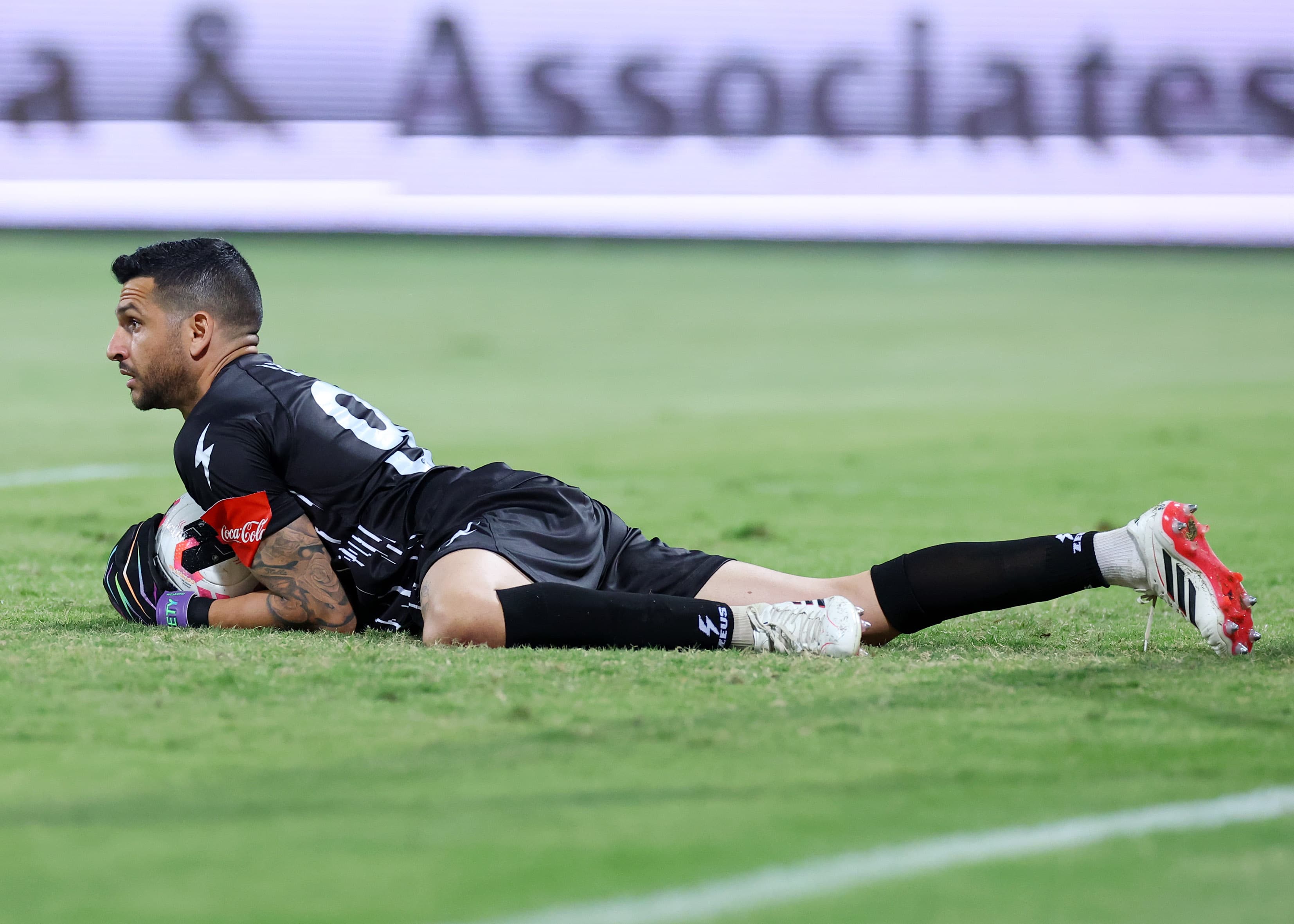 A goalkeeper dives to make a save during the AEK Larnaca versus Akritas cup tie