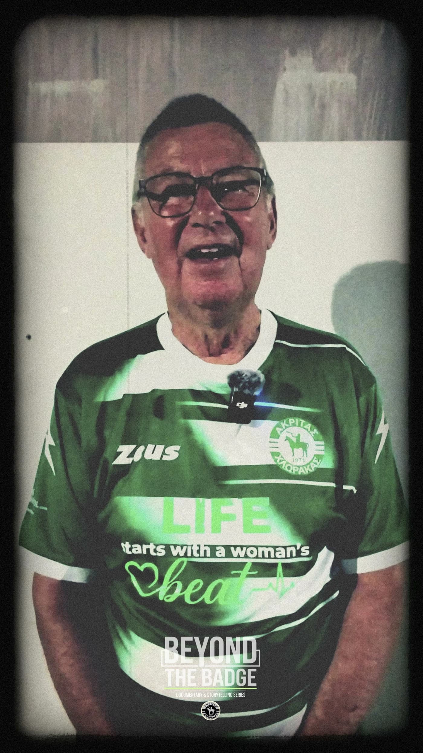Roy wearing an Akritas Chlorakas shirt during Beyond the Badge filming